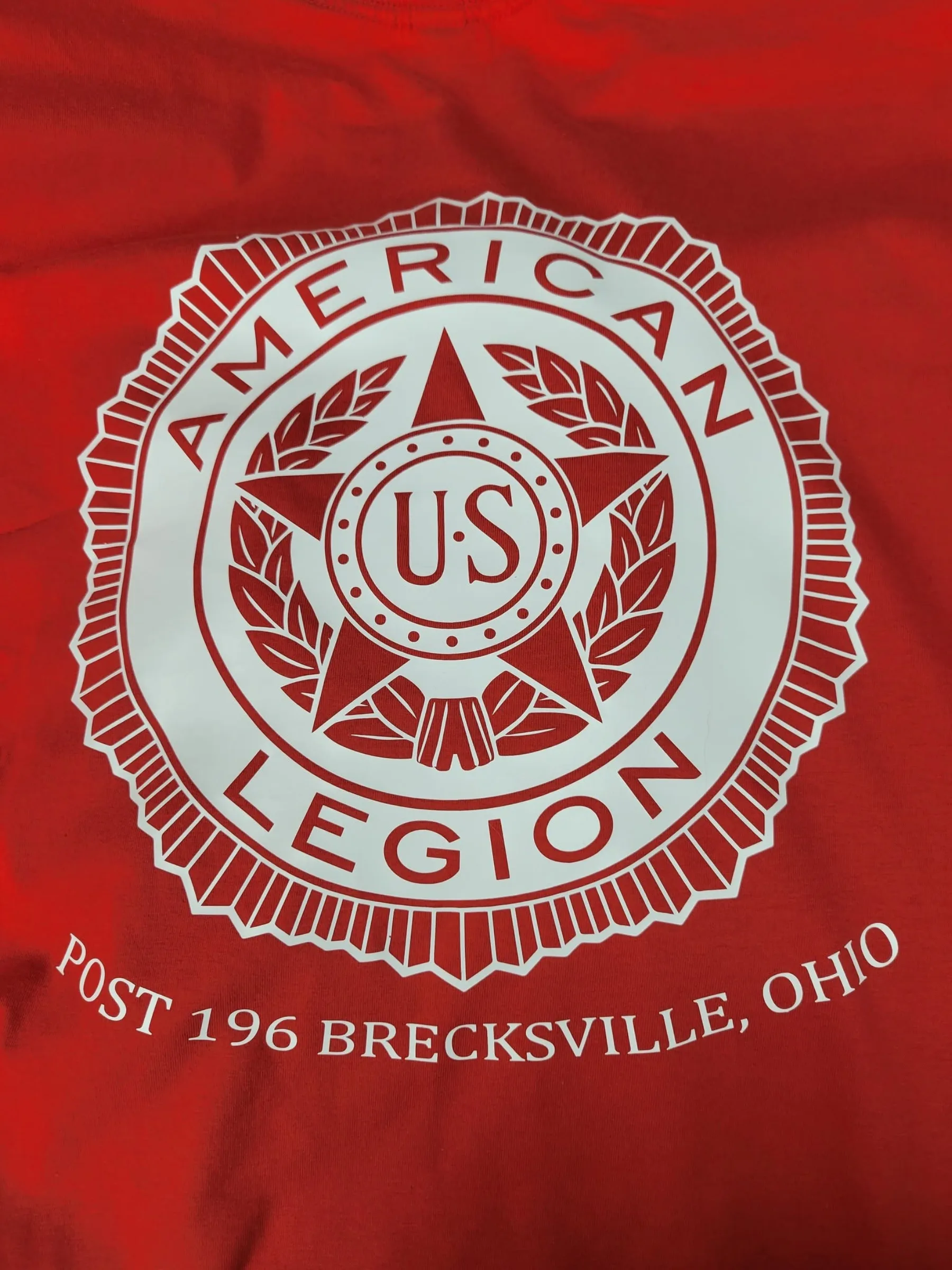Custom red circular team design tee